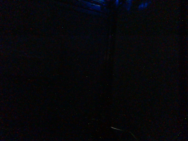 Very dark RGB view of the evaluation scene, with poor visible structure.